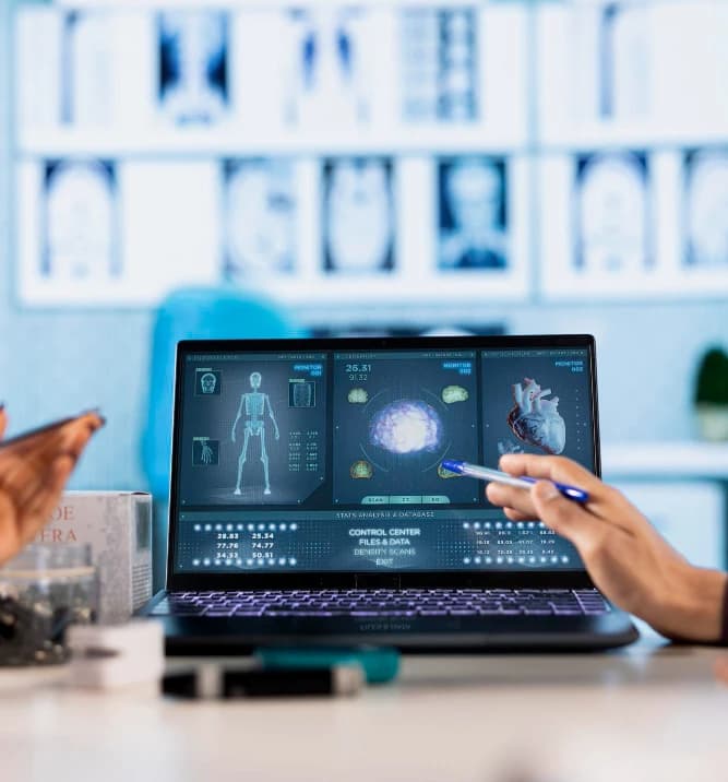 Billing specialist reviewing AI-assisted claim data on screen