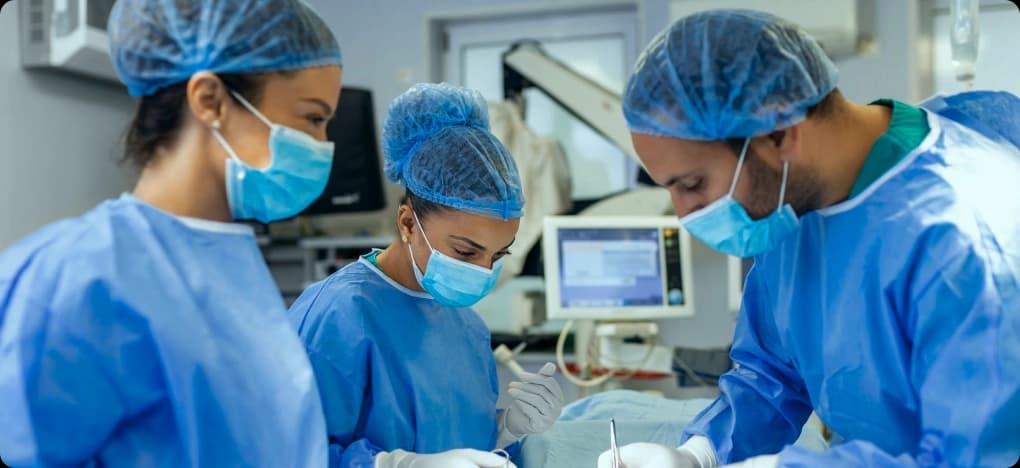 General surgery team operating in a hospital theatre