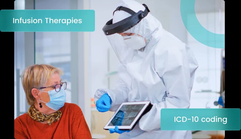 Infectious disease clinician in protective equipment reviewing a patient's imaging on a tablet