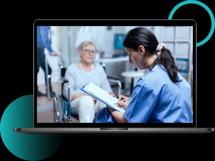 Clinician reviewing a resident's care plan on a laptop screen