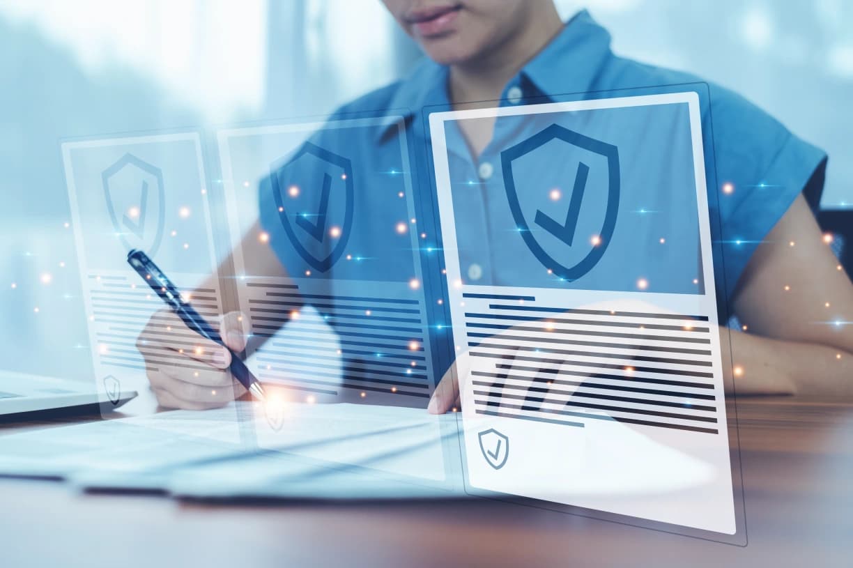 Professional signing documents behind floating HIPAA compliance shield panels
