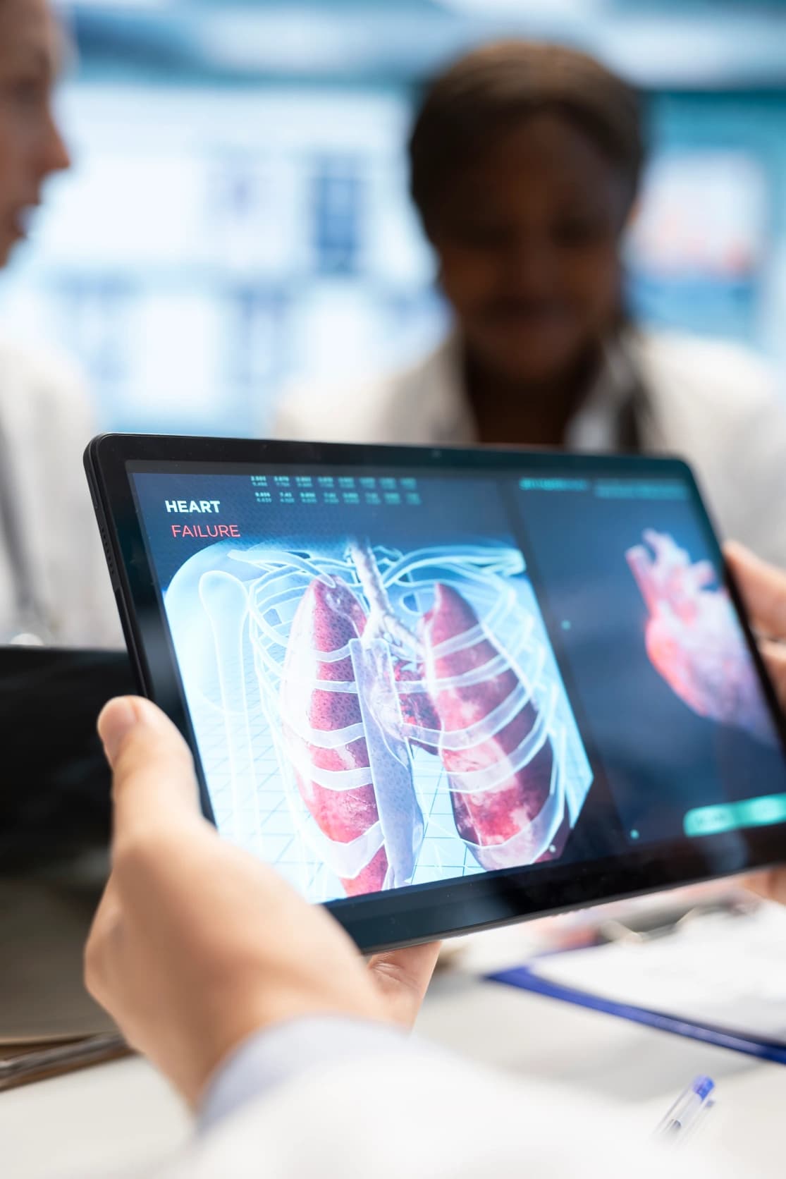 Clinician holding a tablet showing a 3D chest and lung scan