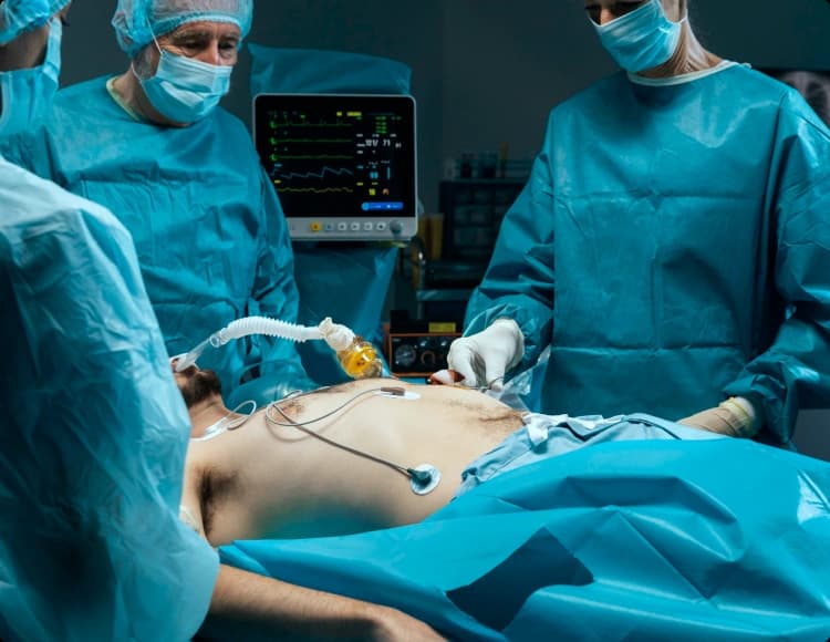 Vascular surgery team operating in a hospital theatre