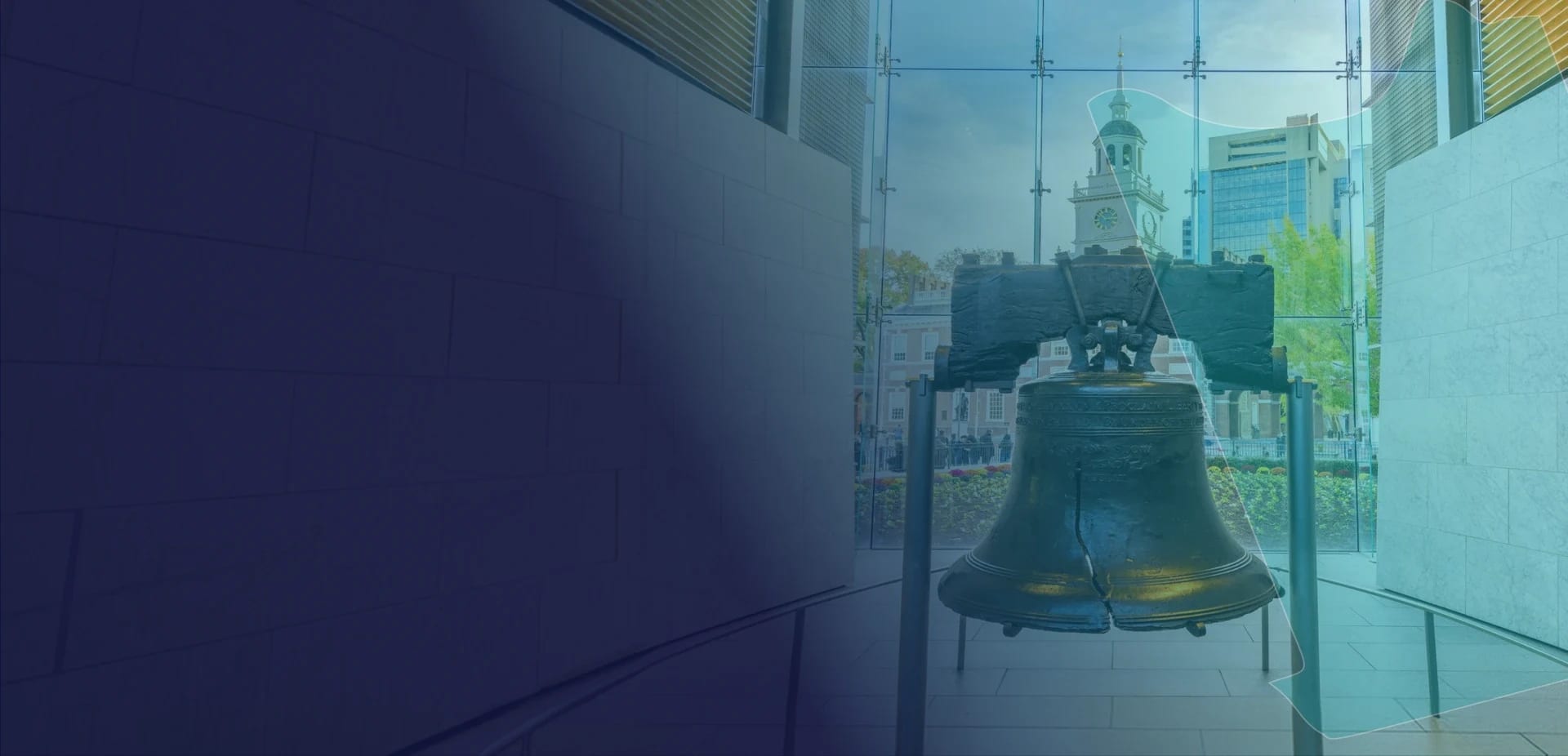 The Liberty Bell in Philadelphia with Independence Hall behind it, framed by a teal outline of Pennsylvania