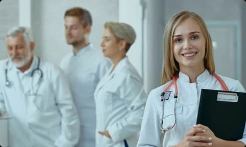 Group practice care team standing together in a clinic