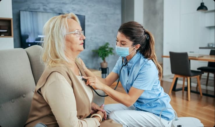 Physician reviewing patient records at a solo practice desk