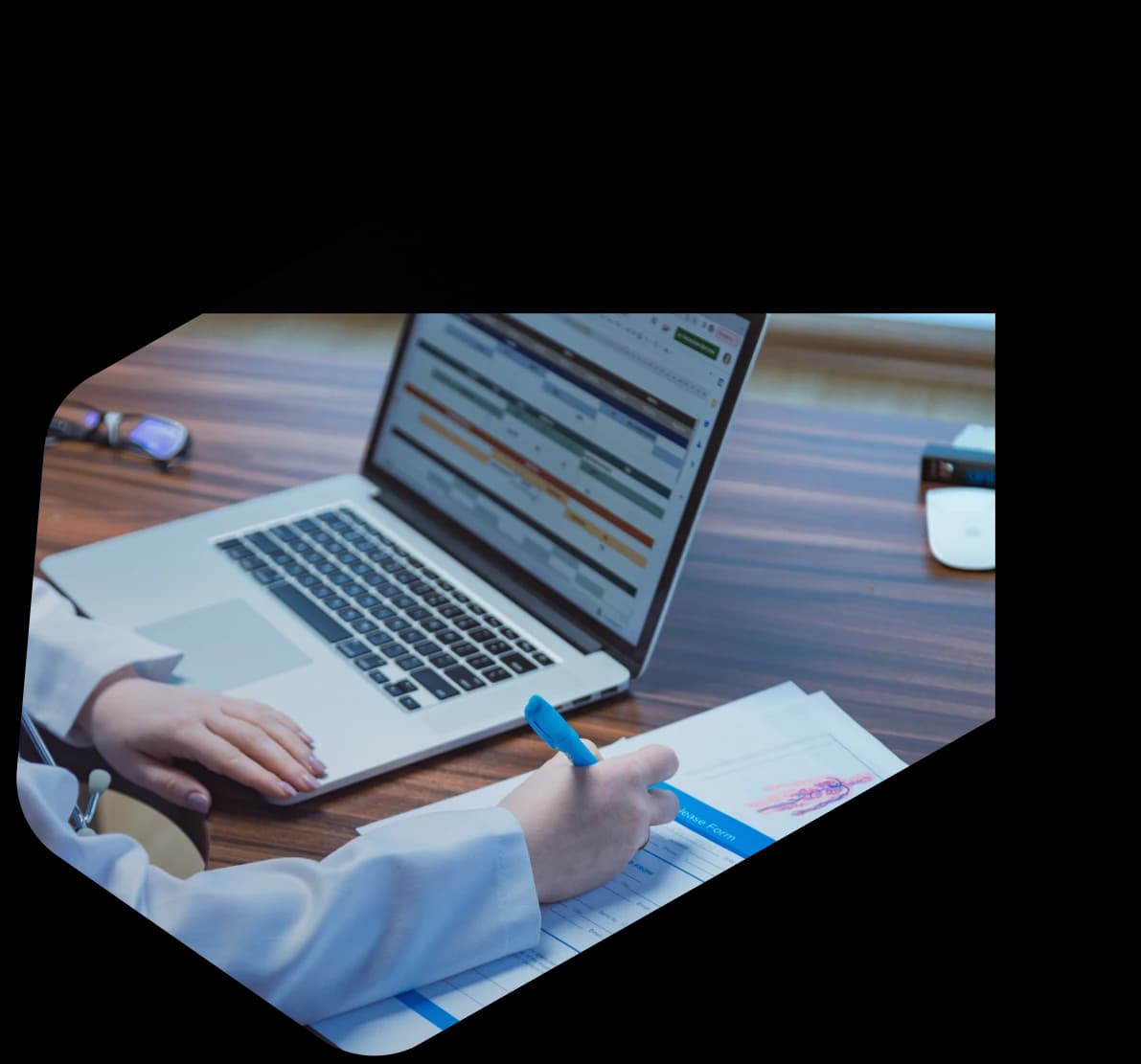 Two Dastify Solutions credentialing specialists reviewing provider enrollment paperwork together