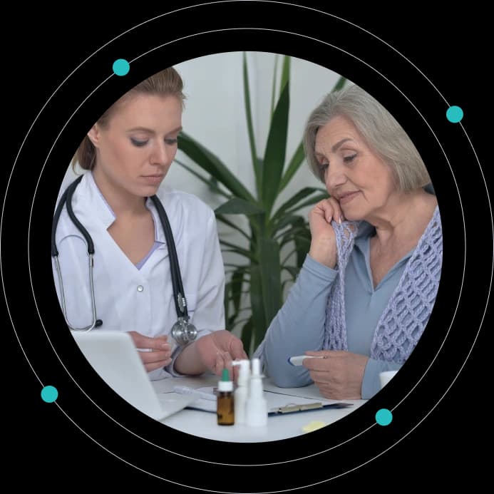 Geriatric care physician reviewing billing paperwork with an older patient