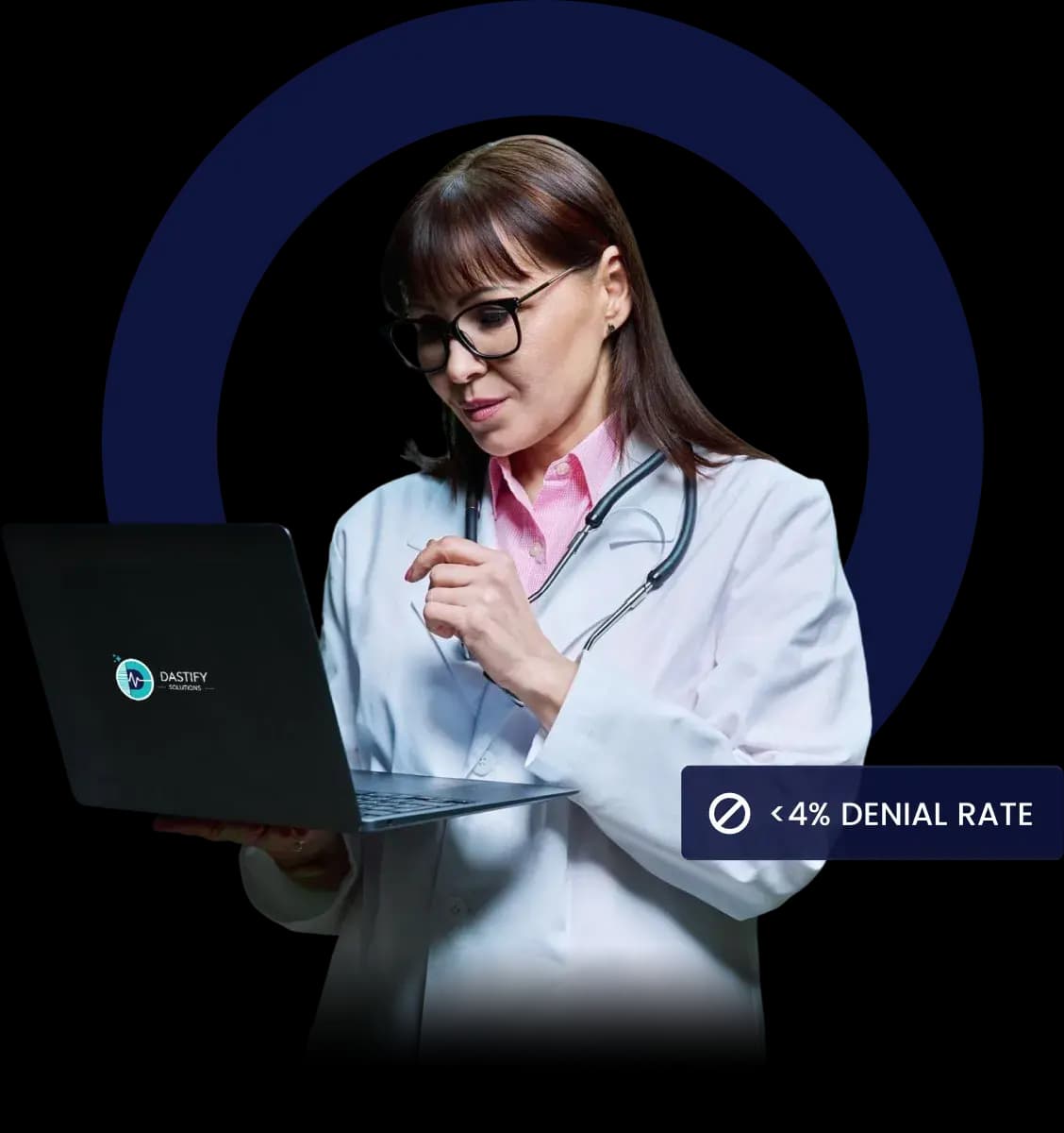 Clinician in a white coat reviewing a laptop