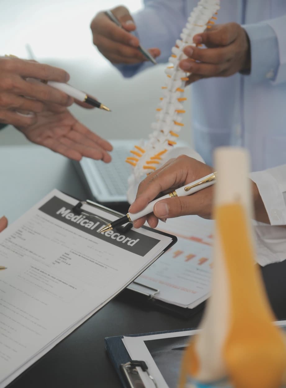 Orthopedic doctor reviewing a patient's medical record