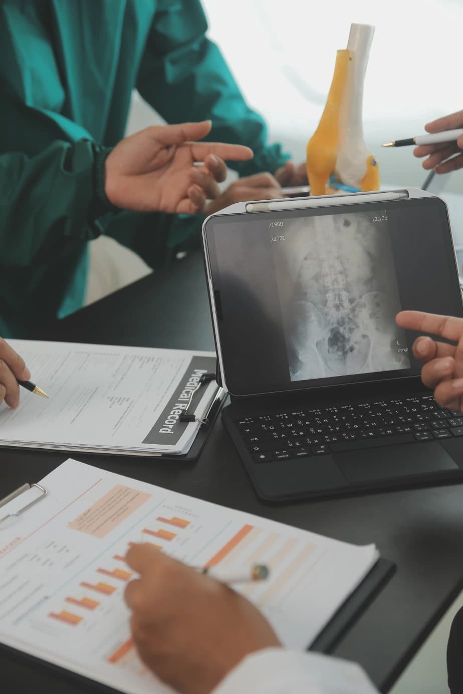 Orthopedic billing team reviewing claim status together